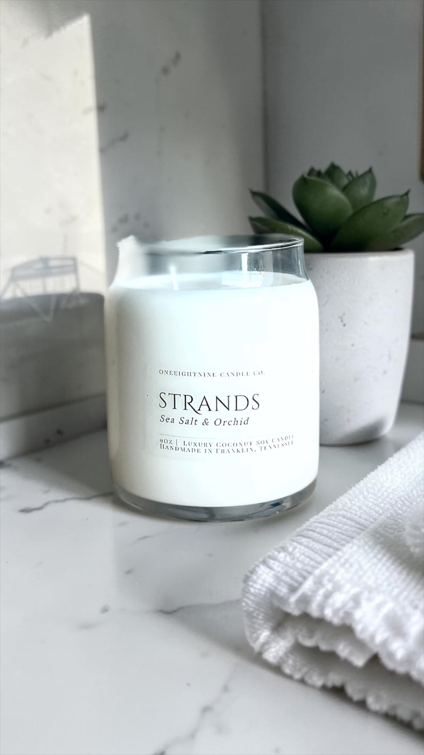 Strands 9 oz (9 Oz Double Wick Candle) Ozone, Orange, Sea Salt, Freesia, Green Leaves, Tonka Bean, Light Musk, Amber